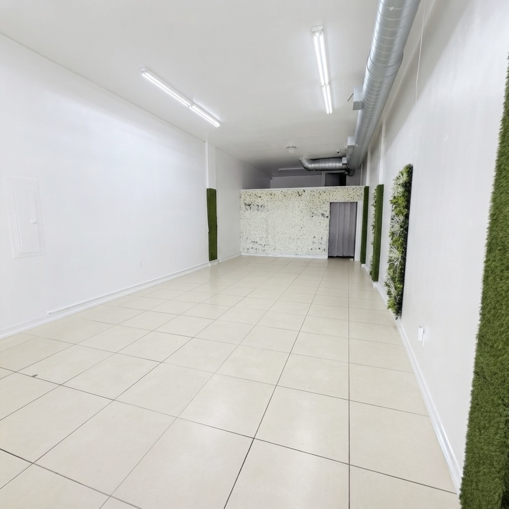 Flower wall and greenery backdrop, full room view